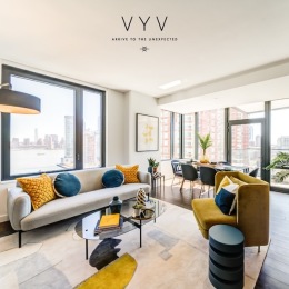 a living room with a couch and chairs