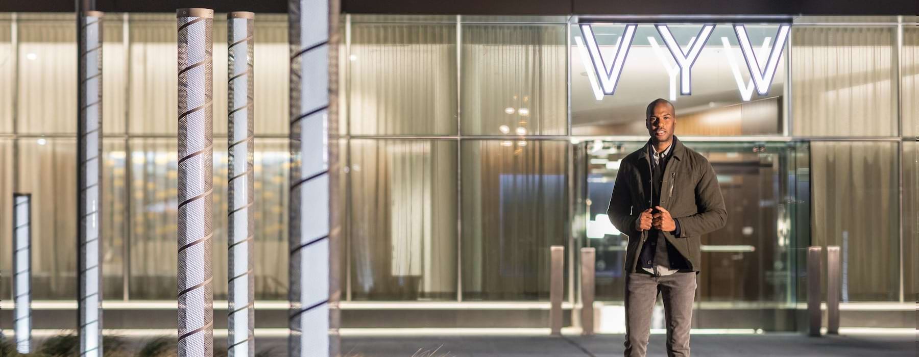 a man walking in front of a building